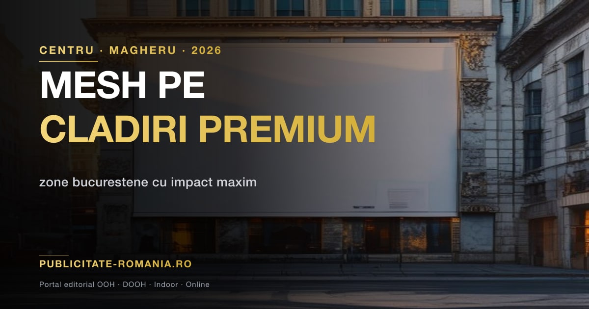 Mesh publicitar pe fatada unei cladiri din centrul Bucurestiului la apus — suprafata de zeci de metri patrati cu impact vizual asupra arterei principale
